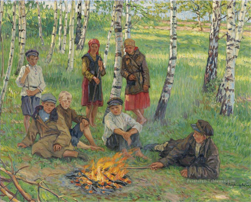 Par le feu de camp Nikolay Bogdanov Belsky enfants impressionnisme enfant Peintures à l'huile